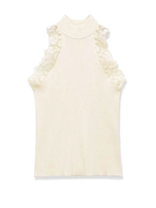 Close-up of cream knit sleeveless top featuring delicate lace details on the high neckline