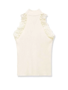 Close-up of cream knit vest featuring elegant lace trim and ribbed texture details