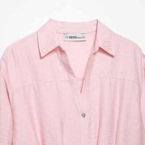Pink V-neck blouse for women with soft textured fabric and classic lapel collar