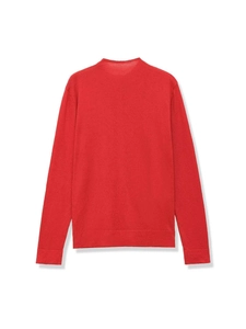 Dettaglio del cardigan rosso a maglia con polsini a costine e bordi con volant fini