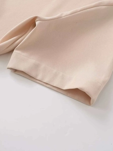 Detailed macro view showing the twill fabric texture and clean stitching of this midi dress