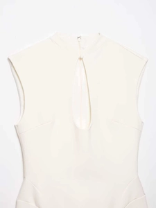 Detail of ivory sleeveless dress featuring a standing collar and front keyhole cutout design