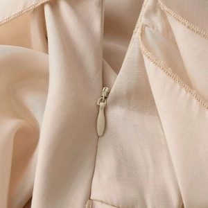 Chic apricot maxi skirt with invisible zipper detail and premium woven fabric