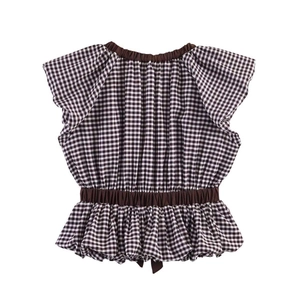 Detailed view of gingham peplum top with butterfly sleeves and a small decorative bow