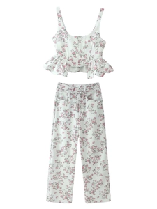 Detailed flat lay of a floral crop top and wide-leg trousers set with ruffles and a belt