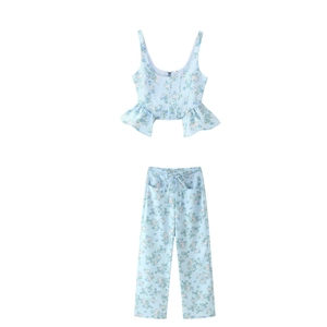 Detail of light blue floral print crop top and high waist pants set with waist tie