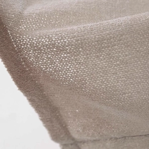 Detailed macro view of the breathable beige knit fabric texture for this summer vest