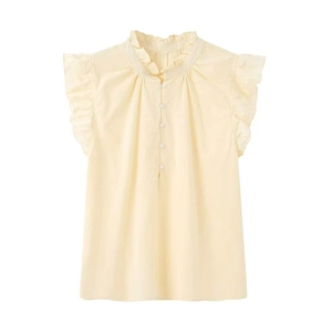 Close-up of ruffled stand-up collar and button-up detail on a yellow sleeveless shirt
