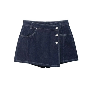 Dark blue denim skort with asymmetrical wrap design and silver buttons on white background