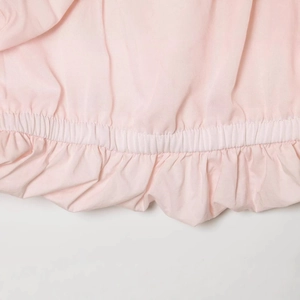 Chic light pink mini dress with ruffle details and elastic hem in premium nylon fabric