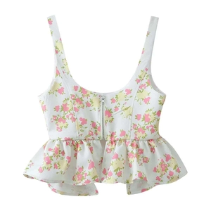 Detail of floral print top with silver front zipper and elegant ruffled hemline