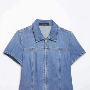 Short sleeve denim shirt with turn-down collar and front zipper closure in washed blue color