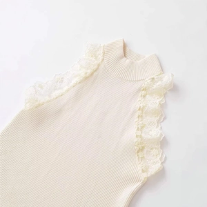 Elegant cream sleeveless knit top with lace trim and mock neck, flat lay view