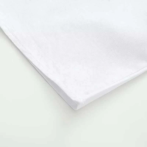 Detail view of the white ruffled sleeve shirt showing neat edge stitching and woven texture