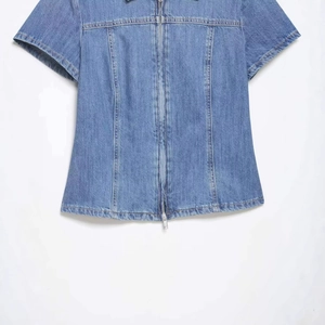 Short sleeve denim shirt in washed blue with front zipper and structured seam details