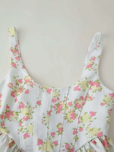 Detail of floral wide-leg set featuring wide straps and structured corset bodice