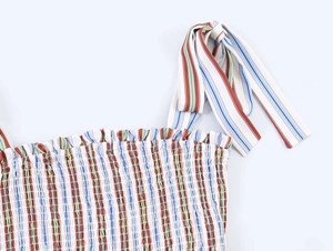 Detail of colorful striped camisole top featuring elastic smocked neckline and tie straps