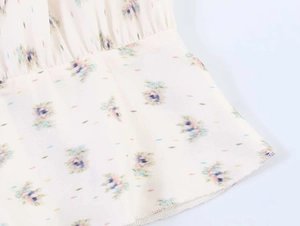 Detail of floral chiffon fabric with delicate rolled hem and colorful print