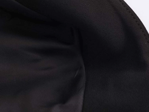 Close-up of black high-density twill fabric showing detailed texture and weave patterns
