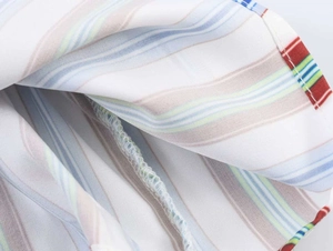 Macro shot of colorful striped fabric showing high-quality stitching and seaming details