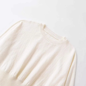 Elegant cream-white crewneck knit sweater with premium ribbed cuffs and soft texture