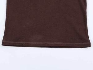 Detail of double-needle hem stitching on brown knit fabric for high-quality finish