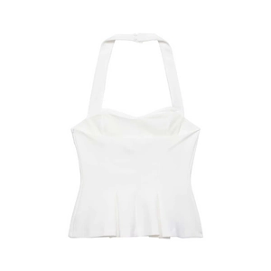 Detail view of white halter neck top featuring pleated hem and back button closure