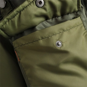 Army green flight bomber jacket with metallic snap buttons and premium nylon fabric texture