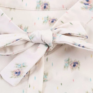 Floral print shirt for women featuring a minimalist bow-tie detail in cream and light blue