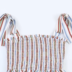 Colorful smocked striped crop top with tie-up ribbon straps for a stylish summer vacation