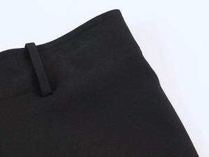 Close-up of black suit trousers waist with detailed belt loops and premium stitching