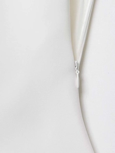 Detailed close-up showing the seamless invisible zipper on this white halter top for women