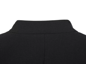 Detail shot of the back collar on a black blazer showing fine textile texture and stitching