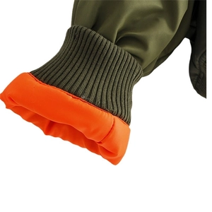 Army green bomber jacket with elastic ribbed cuffs and bright orange contrast lining