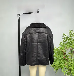 Detail view of the high-quality black faux leather jacket with plush shearling collar
