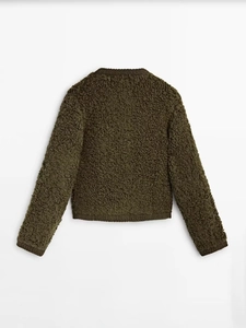 Rear flat lay of olive green bouclé knit cardigan showing thick textured fabric