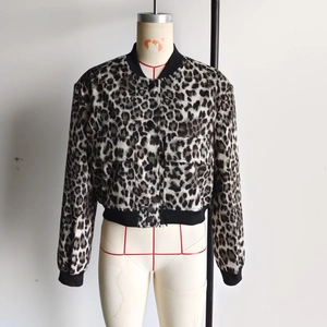 Detail of leopard print bomber jacket featuring large flap pockets and ribbed cuffs