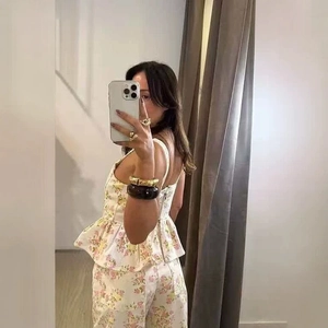 Floral print summer set with spaghetti strap ruffled top and wide leg trousers
