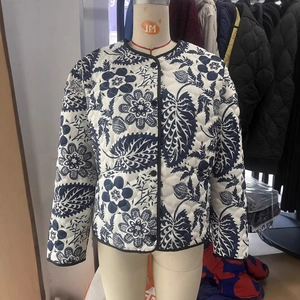 Women's vintage floral quilted jacket with dark blue pattern and black button closure