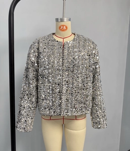 Detail view of sparkly silver sequins on a tweed round-neck jacket for women