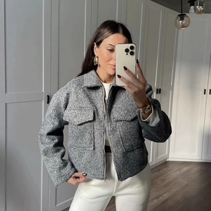 Women's grey textured wool-blend short jacket with zipper closure and large flap pockets