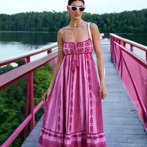 Bohemian style long knit dress with pink ethnic patterns and tassel neck tie