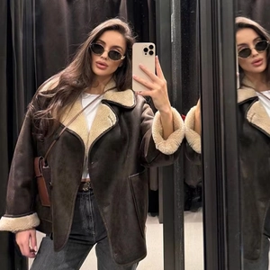 Women's brown shearling aviator jacket with oversized faux fur collar and cozy warm lining