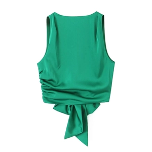 Elegant green satin sleeveless crop top featuring a large decorative bow tie hem