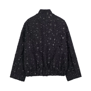 Detailed back view of a black sequined jacket featuring a high collar and elastic hem