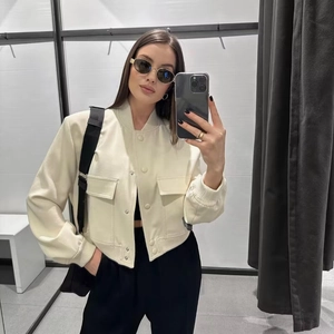 Women's cream white bomber jacket with large flap pockets and ribbed cuffs in a casual style