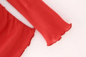Detailed view of the red cotton T-shirt featuring elegant ruffled lettuce edge stitching