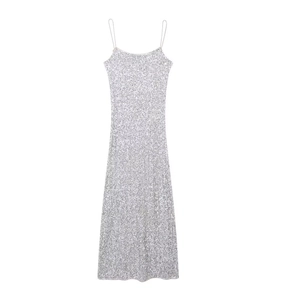 Close-up of silver sequin maxi dress featuring metallic round sequins and thin straps