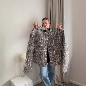 Elegant women's round neck tweed jacket with shimmering silver sequins and long sleeves