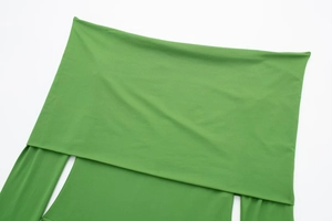 Detailed flat lay view of green off-shoulder bodysuit with long sleeves and knit fabric